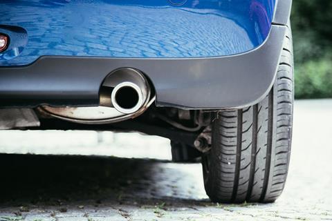 A photo of a car's exhaust pipe