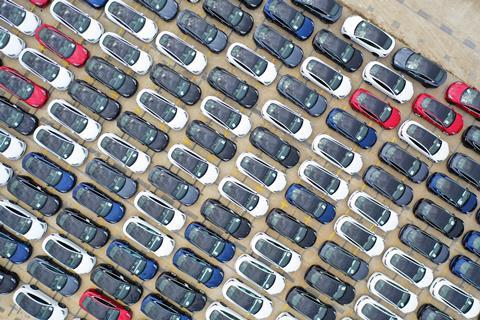 An aerial view of many electric cars