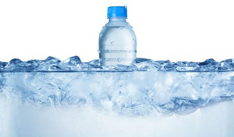 A bottle of liquid water in ice