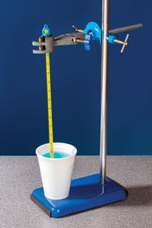 A polystyrene beaker containing a liquid and a thermometer