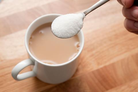 Adding a teaspoon of sugar to a cup of tea