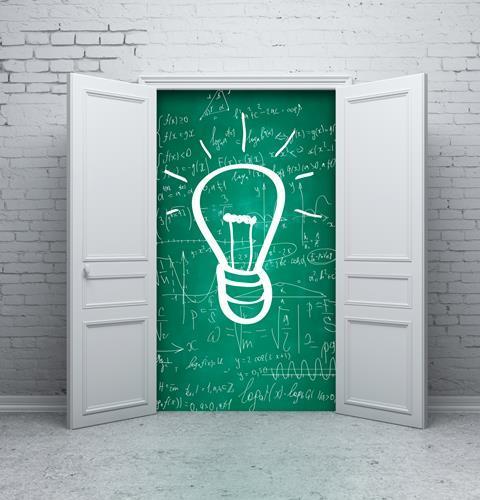 Open door with lightbulb on blackboard behind