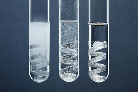 An image showing three test tubes, each containing magnesium strips in hydrochloric acid solutions of different concentrations