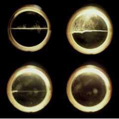 Figure 2 - Disappearance of phase boundary (meniscus) on heating from below critical point (top left) to above critical conditions (bottom right)