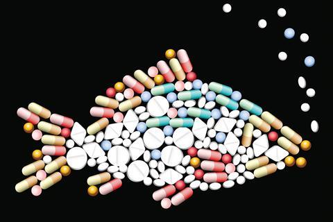 Medications arranged in the shape of a fish