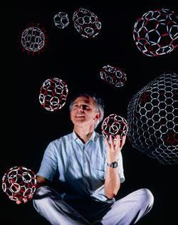 Harry Kroto holding closed buckyball cages