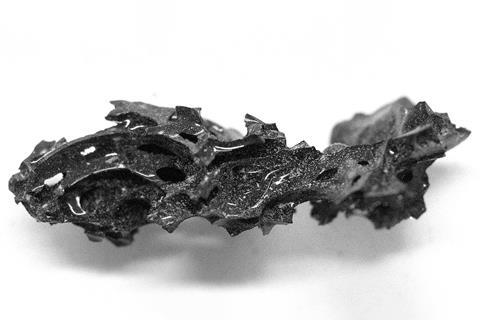 A piece of black glass in an odd shape