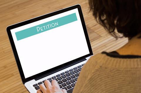 A woman filling in an online petition