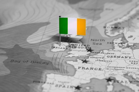 An image showing a greyscale map of Western Europe; a small coloured flag is pinned to the Republic of Ireland