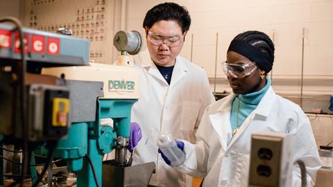 An image showing students at the Michigan Technological University preparing battery material for testing