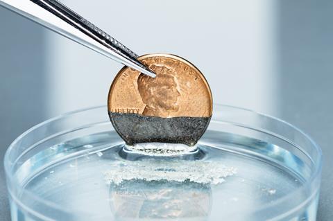 An image showing a copper coin reacting with silver nitrate