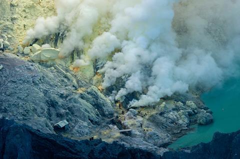 A worker carries sulfur inside the Ijen crater in the Ijen volcano, East Java, Indonesia