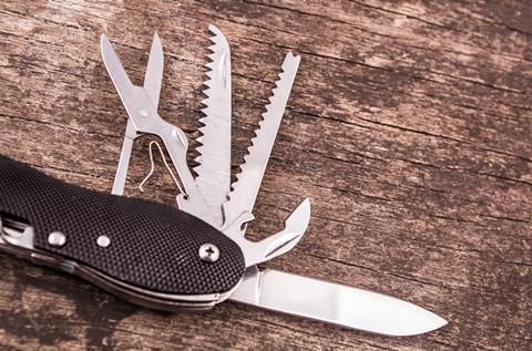 Swiss Army Knife on wooden floor