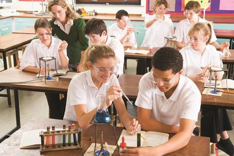 Secondary school students doing practical science