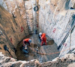 Men work to separate elements form waste