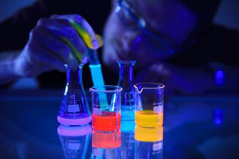 An image showing beakers containing the chemoluminescent compound luminol in beakers