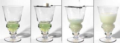 Ice-cold water is dripped onto the sugar cube and the drink goes cloudy, known as the louche effect