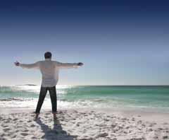 A man on a beach wearing a cotton shirt