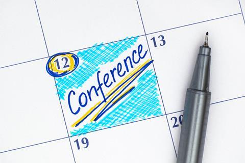 A calendar with a conference scheduled
