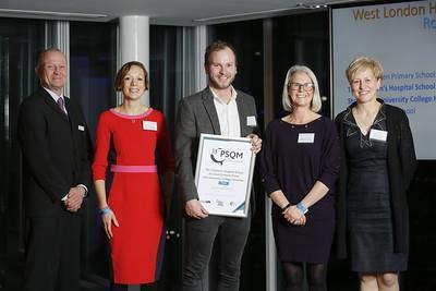 An image showing a line of people with a certificate at the PSQM award evening November 2019