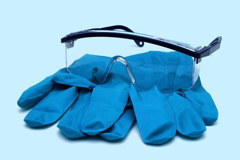 An image showing laboratory goggles and gloves