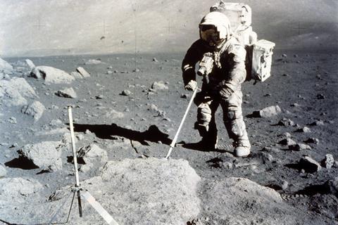 A photo of an astronaut collecting rock samples on the moon