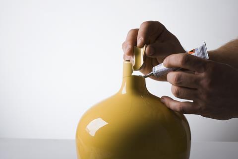 An image showing super glue being used to mend a vase