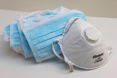 Bundle of face masks on a white table 