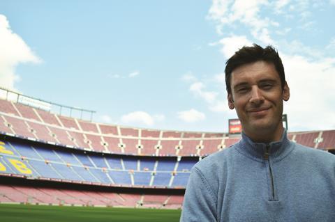 Charles standing in a football stadium
