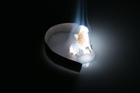 A strip of magnesium burning with a bright white flame