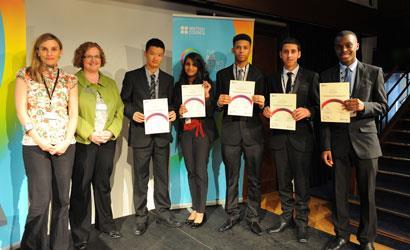 The winning students from Cumberland School receive their certificates from representatives from the British Council and Rolls-Royce