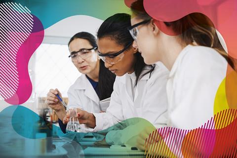An image of a teacher advising two university students in lab coats