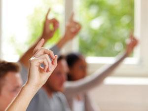 Students raising their hands