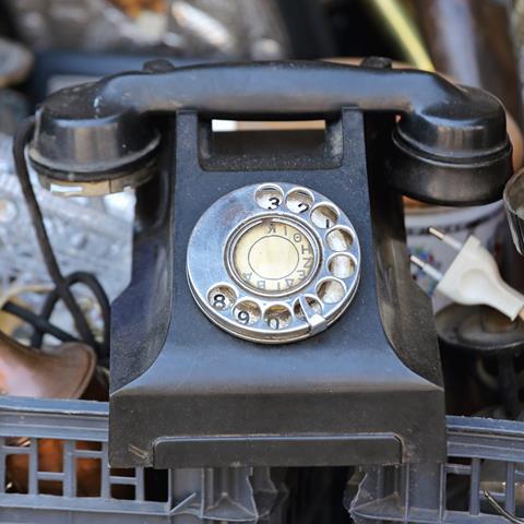 An image showing an old Bakelite telephone