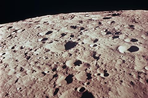 A picture of the moon's surface showing overlapping craters