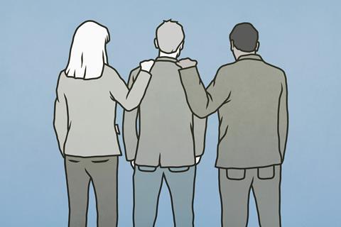 A group of three people standing in support of each other