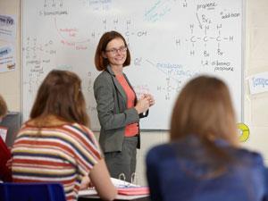 Chemistry teacher with students