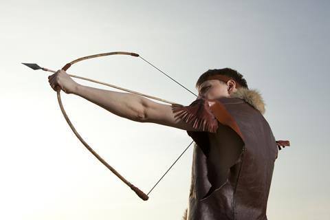 Young archer with arrow and long bow