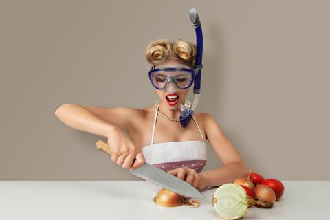 Wearing a mask and snorkel to chop onions