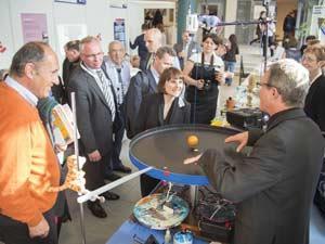 Teachers watch a physics demonstration