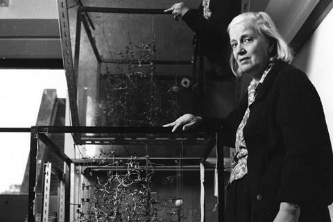 Dorothy Hodgkin with a model of DNA