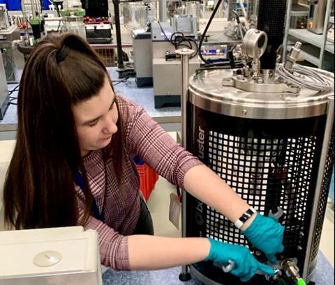 Erin Maciejewski working in a lab.