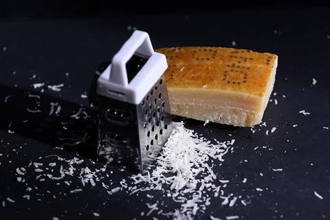 Some hard cheese and a grater