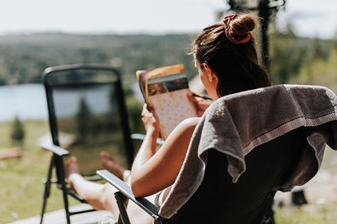 A woman doing puzzles in the sunshine