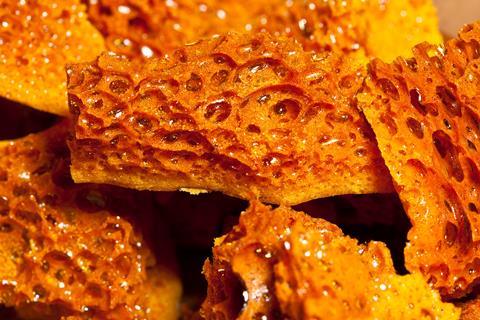 A close-up of the bubbles in crunchy honeycomb confectionery