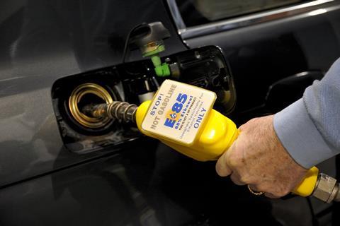 Someone using a bio ethanol petrol pump to fill up their car with E85