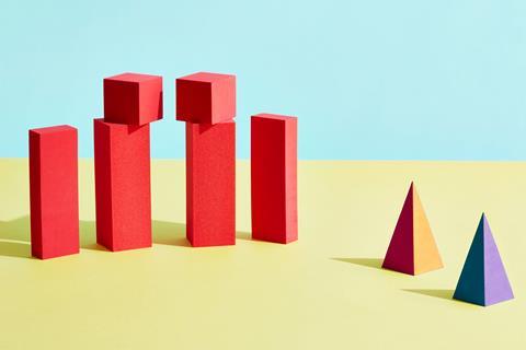 A group of wooden red blocks and one orange and one purple wooden pyramids