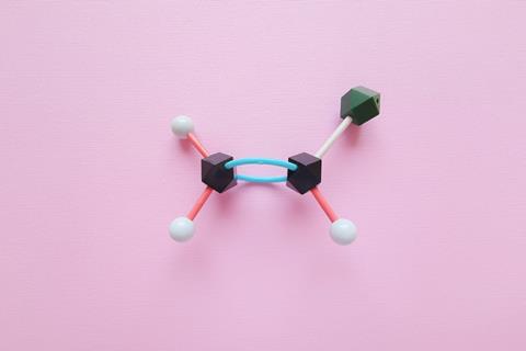 Stylised representation of chloroethene on a pink textured background