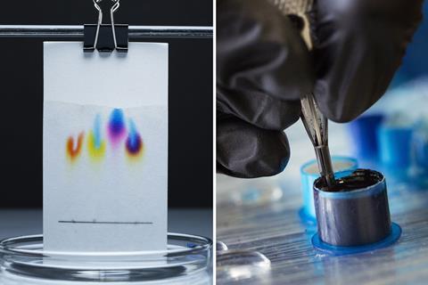 A piece of damp paper with inks that have separated into their different component colours and a tattoo artist dipping their tool into a well of tattoo ink
