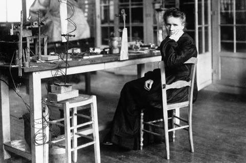 A photograph showing Marie Sklodowka Curie in her laboratory